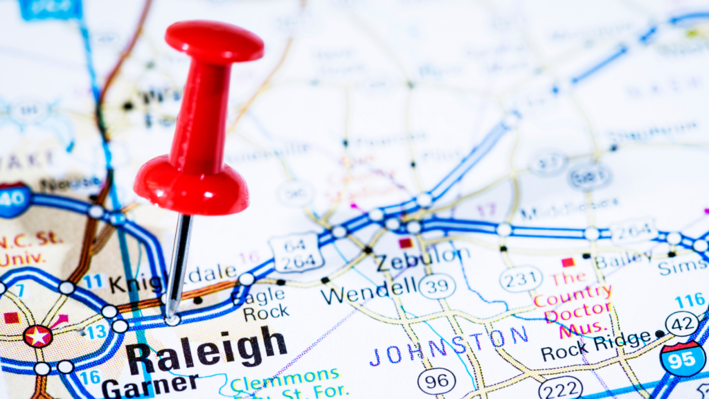 Map of Raleigh, North Carolina with a red pushpin marking the location, illustrating geo-targeting for local SEO strategies.