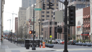 Urban street scene in Raleigh, NC, featuring traffic lights, buildings, and parked cars, illustrating local environment relevant to boosting Google rankings and local SEO strategies.